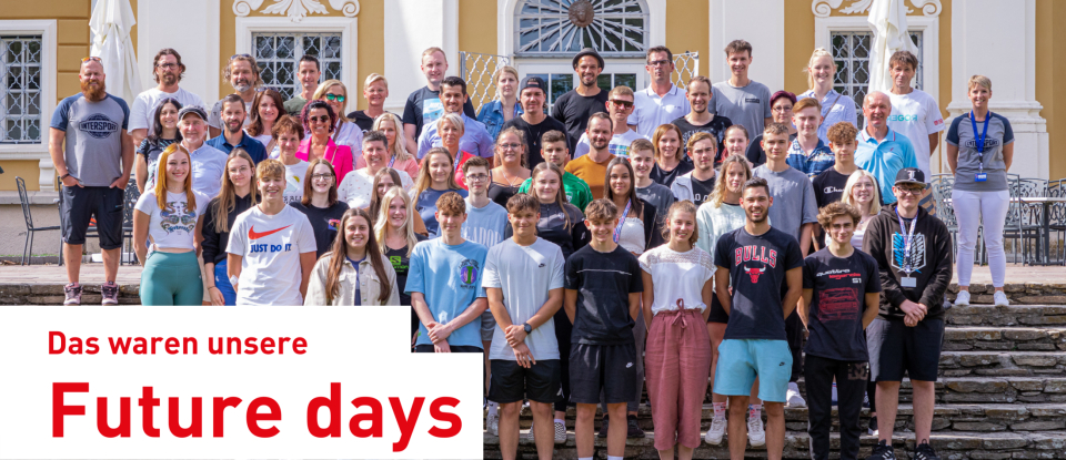 Large group of young people posing on the steps of an ornately decorated building at the "Future Days" event.